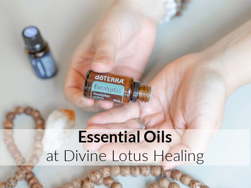 Hands holding a bottle of essential oil labeled Balance by doTERRA.